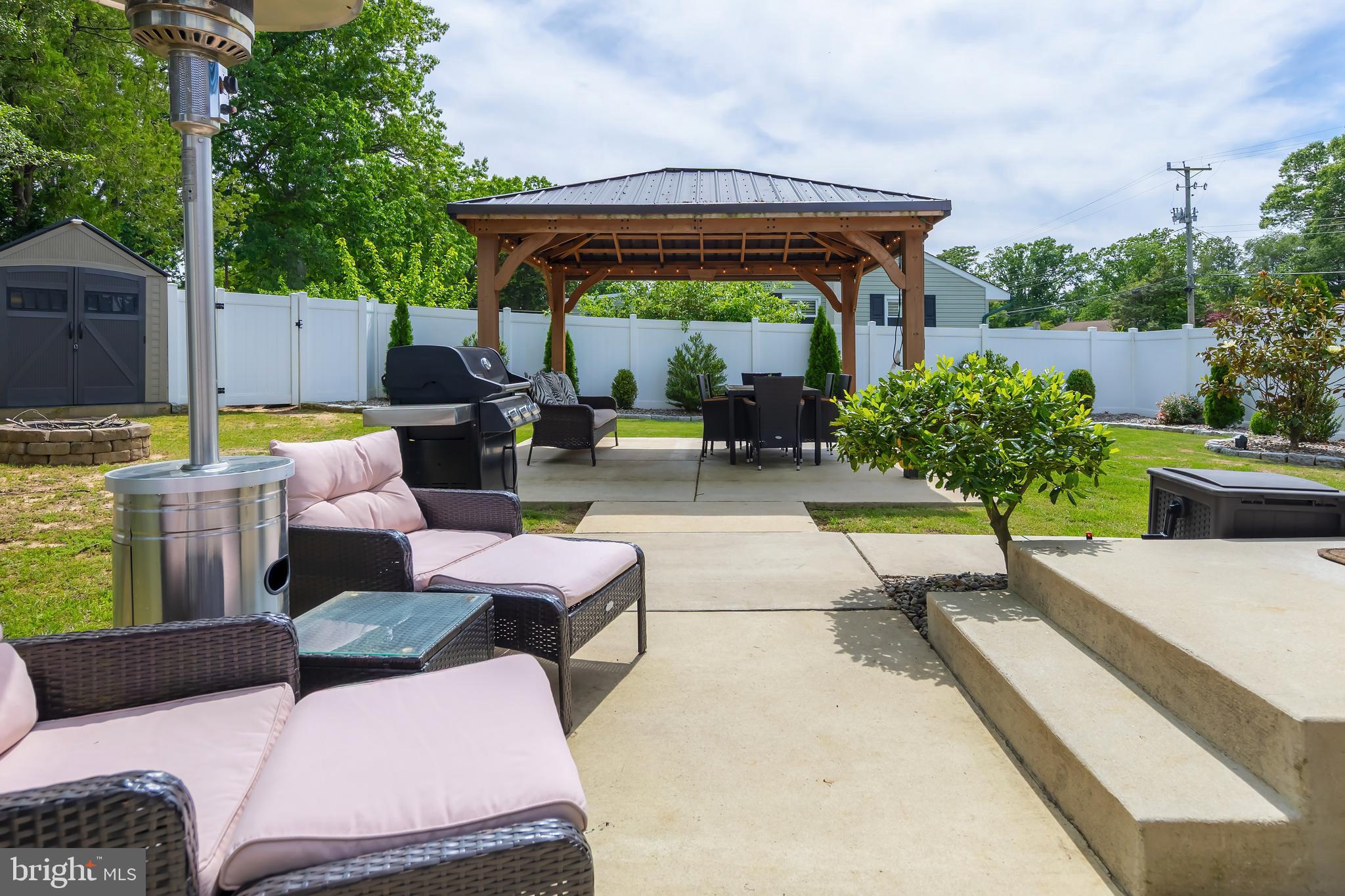 31 Hill Drive Pine Hill, NJ 08021 - Photo 25 of 27 a patio with patio a couch and chairs