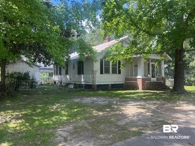 321 Grant Street Chickasaw, AL 36611 - Photo 1 of 13 View of front of property featuring a chimney