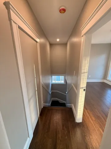 a view of entryway with wooden floor