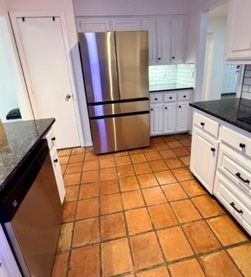 5045 Thunder Road Dallas, TX 75244 - Photo 12 of 28 a kitchen with granite countertop a refrigerator a stove a sink and a counter top