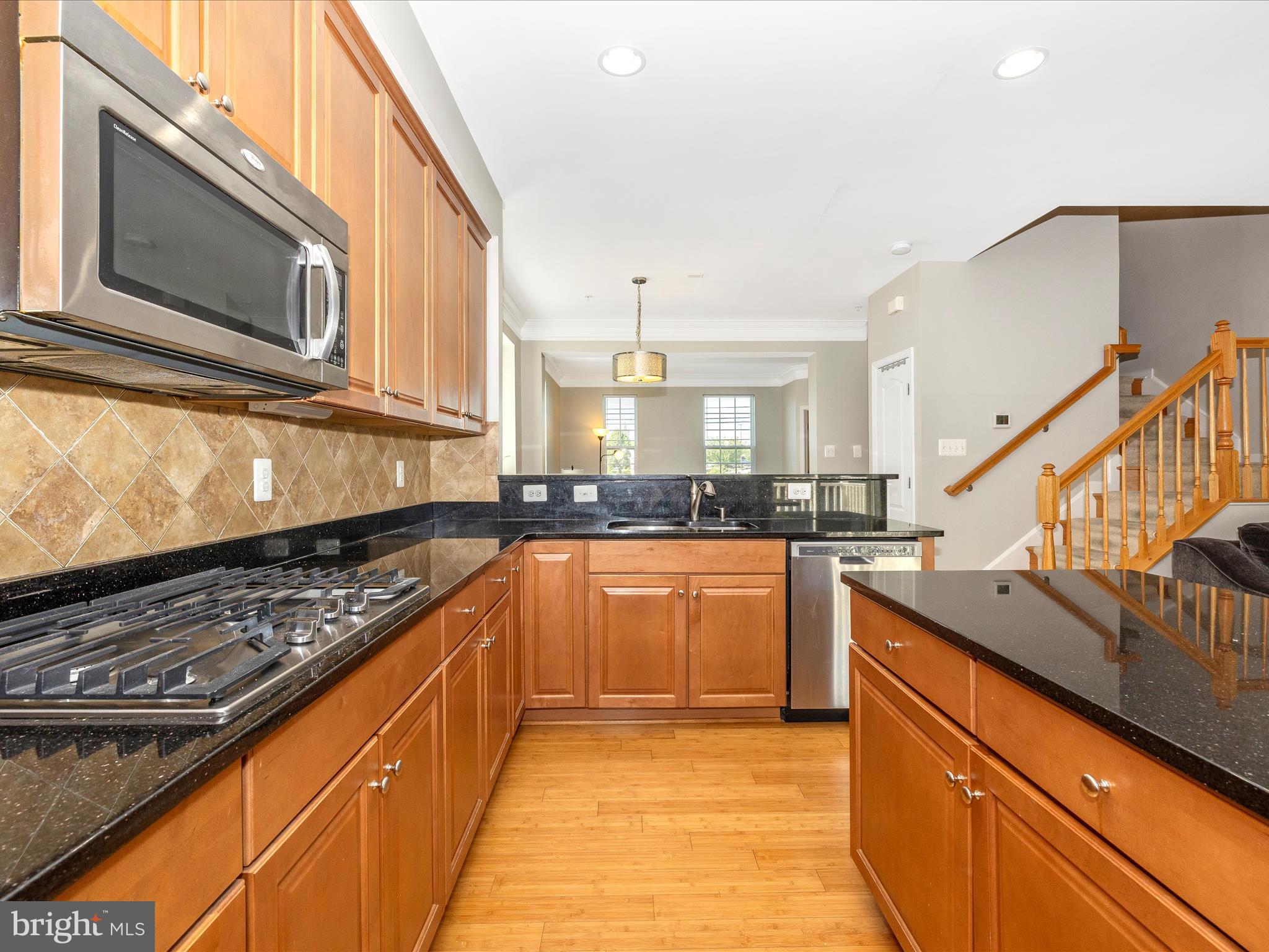 7801 Wormans Mill Road Frederick, MD 21701 - Photo 11 of 35 a kitchen with stainless steel appliances granite countertop a sink and cabinets