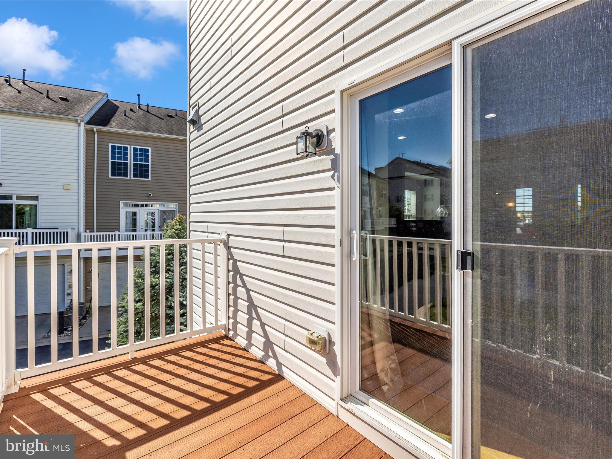 7801 Wormans Mill Road Frederick, MD 21701 - Photo 17 of 35 a view of a balcony with wooden floor