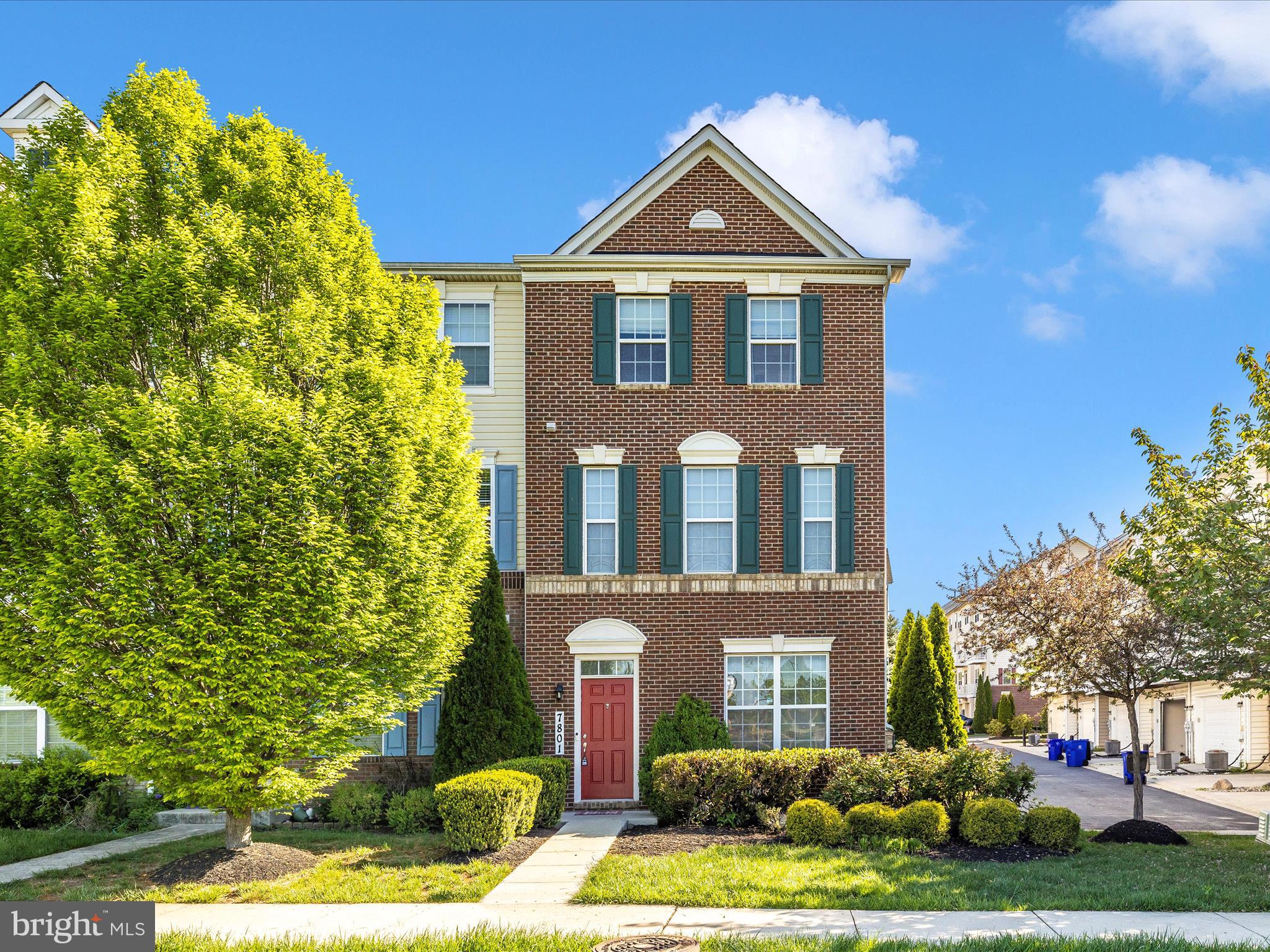 7801 Wormans Mill Road Frederick, MD 21701 - Photo 29 of 35 front view of a brick house with a yard