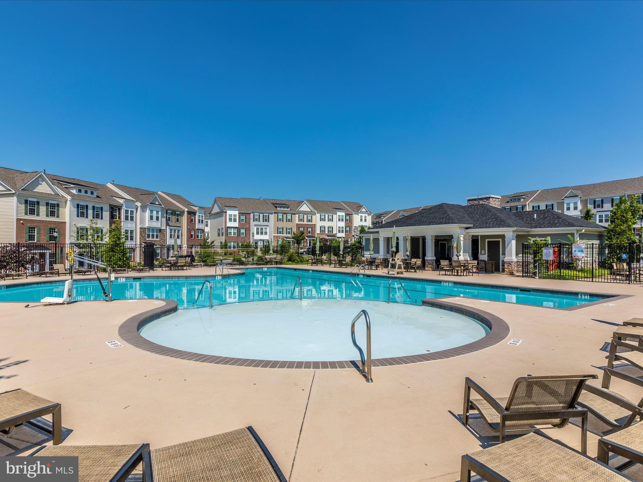 7801 Wormans Mill Road Frederick, MD 21701 - Photo 33 of 35 a view of a house with pool and chairs