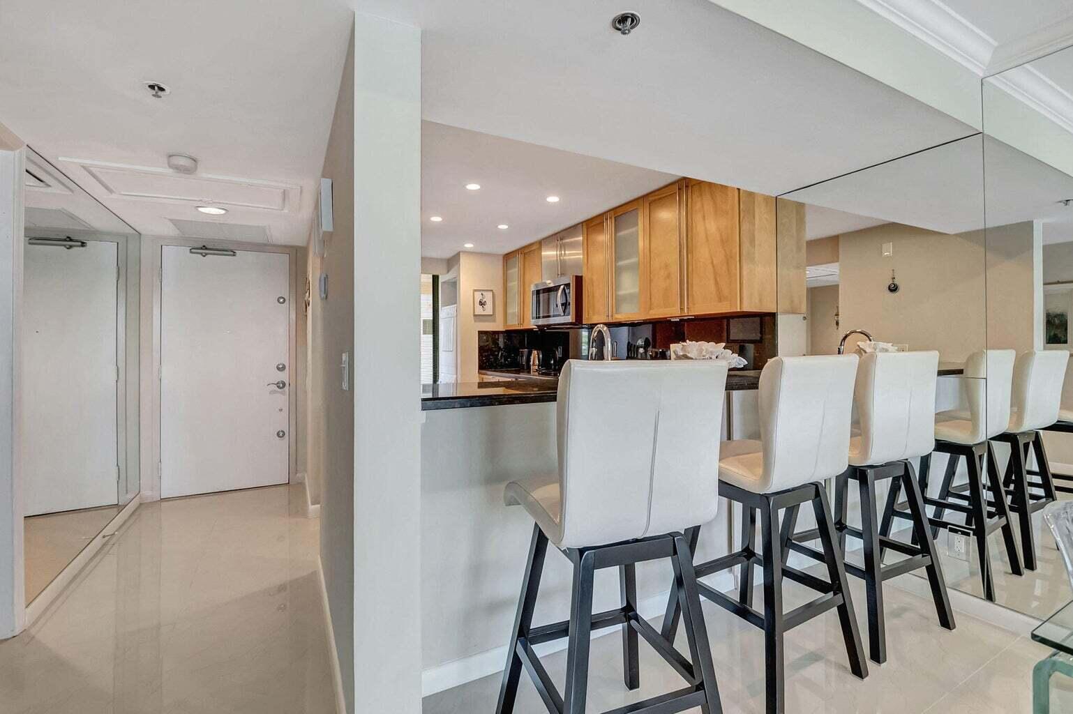 2707 North Ocean Boulevard, Unit D205 Boca Raton, FL 33431 - Photo 18 of 51 a view of a dining room with furniture