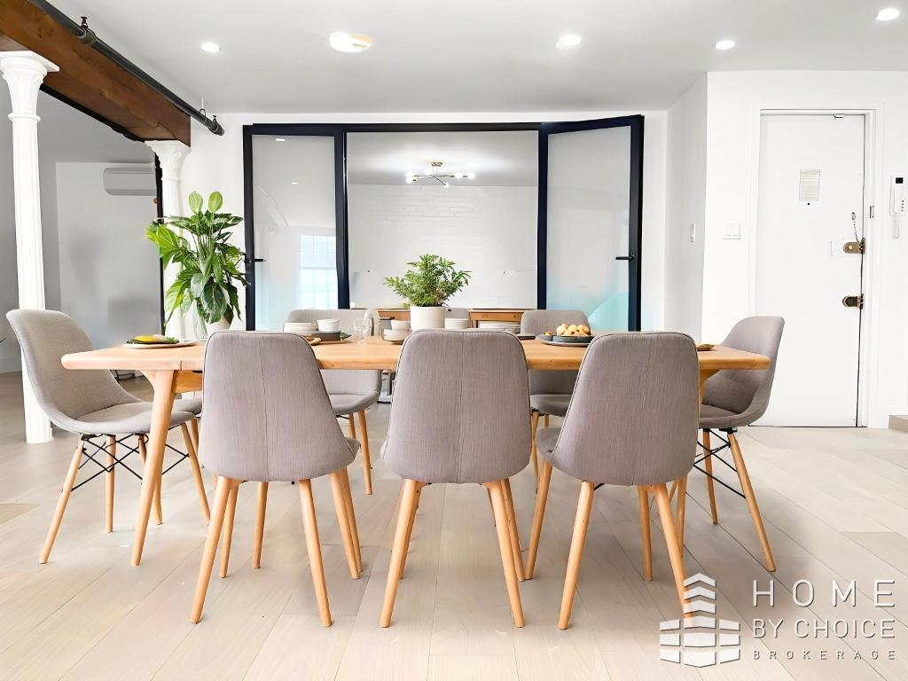 25 Peck Slip, Unit 3 Manhattan, NY 10038 - Photo 8 of 15 a view of a dining room with furniture and a potted plant