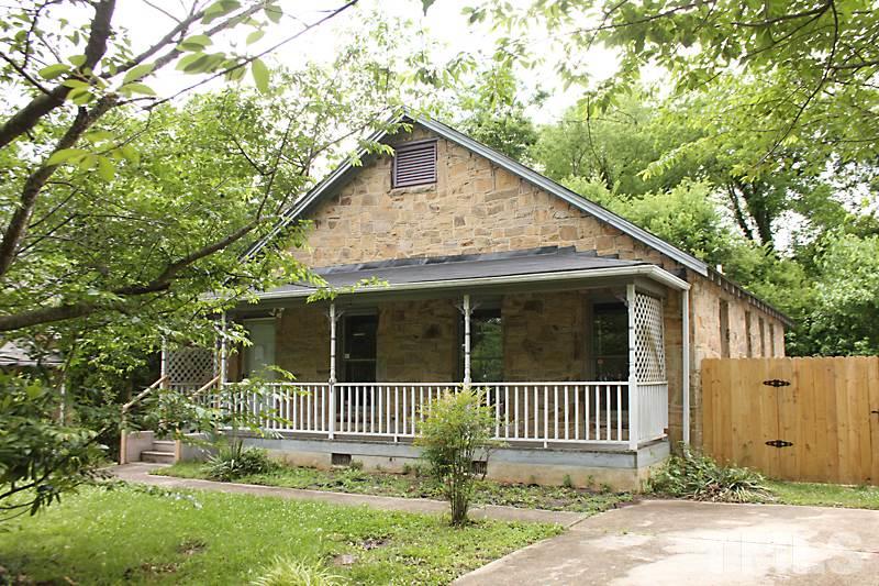 a front view of a house with a porch