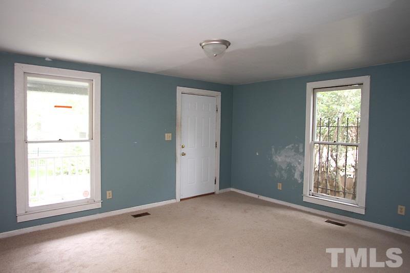 520 Chavis Way Raleigh, NC 27601 - Photo 3 of 13 an empty room with windows