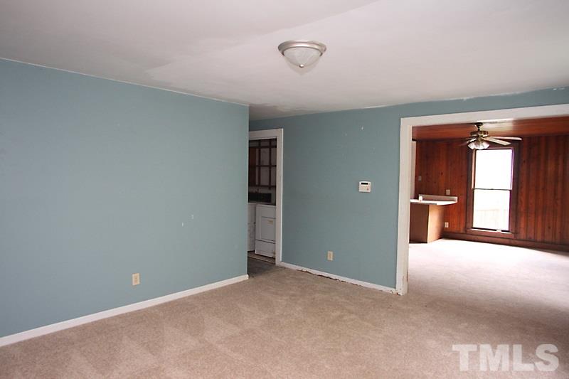 520 Chavis Way Raleigh, NC 27601 - Photo 4 of 13 a view of an empty room with window and wooden floor