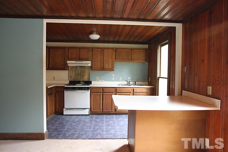 520 Chavis Way Raleigh, NC 27601 - Photo 6 of 13 a kitchen with a sink and a refrigerator