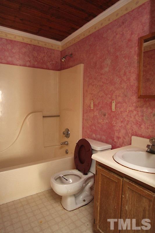 520 Chavis Way Raleigh, NC 27601 - Photo 8 of 13 a bathroom with a sink a toilet and a mirror