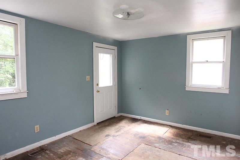 520 Chavis Way Raleigh, NC 27601 - Photo 10 of 13 an empty room with windows