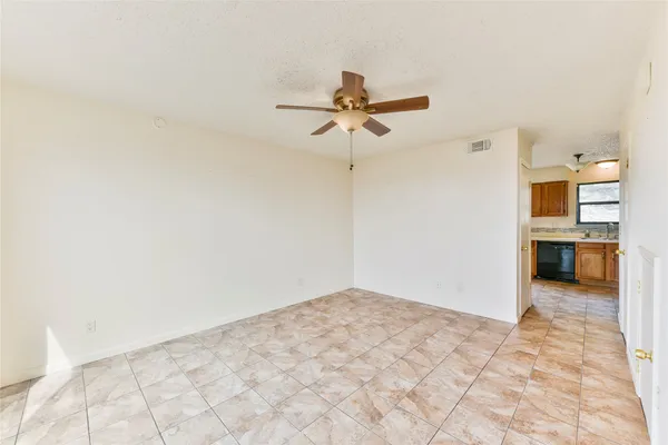 a view of a hallway with a kitchen