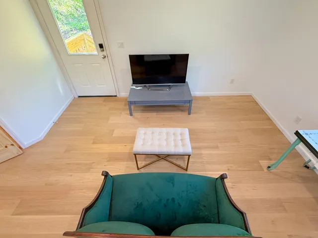 a living room with a couch and a flat screen tv