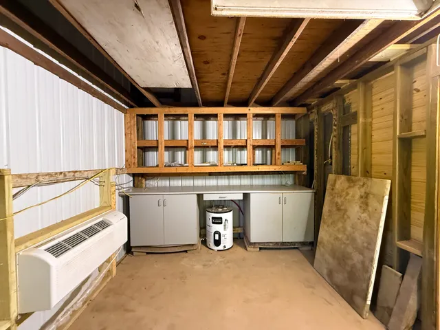 a view of washer and dryer with bathtub in room