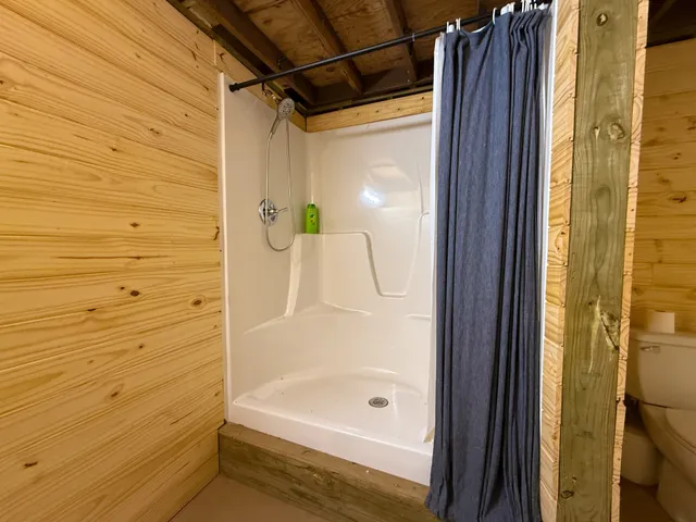 a bathroom with a shower and a tub