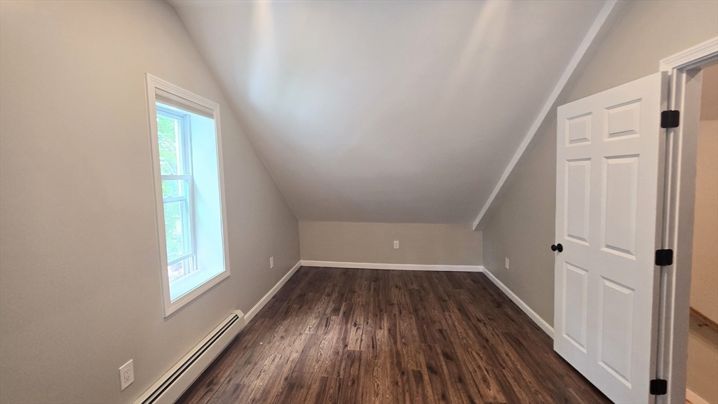 15 Central Street, Unit 4 Georgetown, MA 01833 - Photo 14 of 24 a view of a hallway with wooden floors and stairs