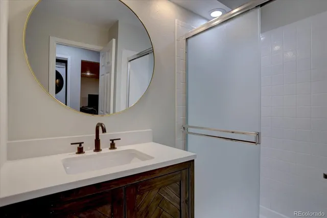 a bathroom with a sink and a mirror