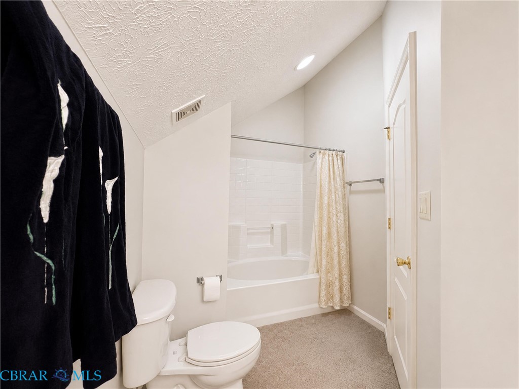 1214 Dandy Loop Road Yorktown, VA 23692 - Photo 42 of 65 a white toilet sitting next to a bathroom sink