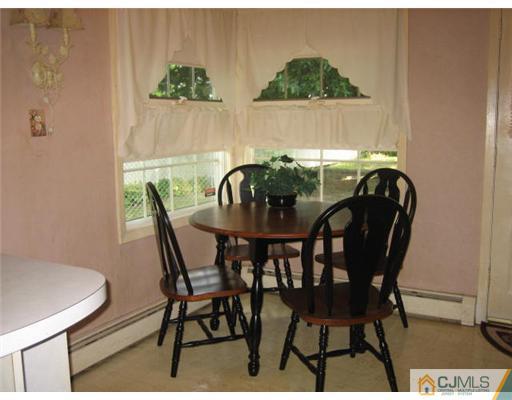 10 Mercury Road Edison, NJ 08817 - Photo 3 of 12 a view of a dining room with furniture and window