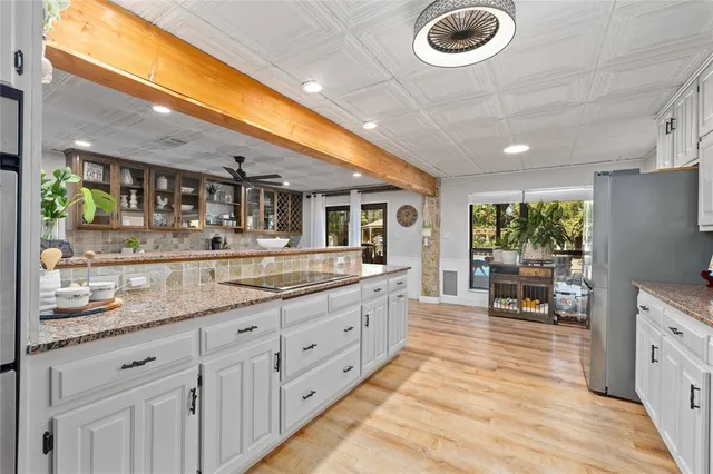 a kitchen with sink and cabinets