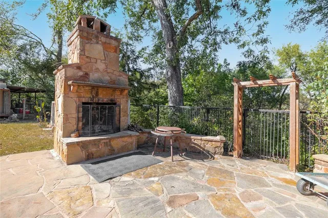 a view of a patio with a fireplace