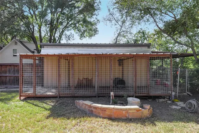 a view of a porch with a wooden fence