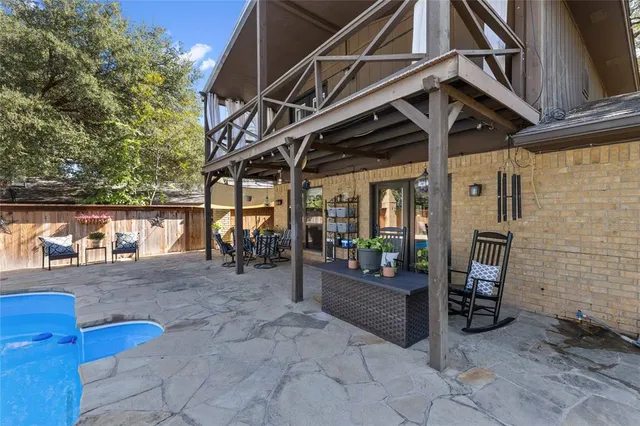 a view of a chairs and table in the patio