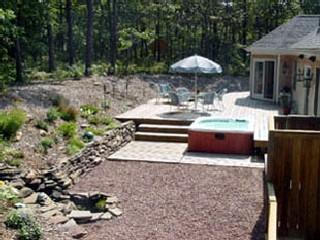 Undisclosed Address Brewster, MA 02631 - Photo 2 of 4 a view of a backyard with sitting area and furniture