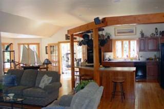 Undisclosed Address Brewster, MA 02631 - Photo 4 of 4 a living room with furniture and a large window