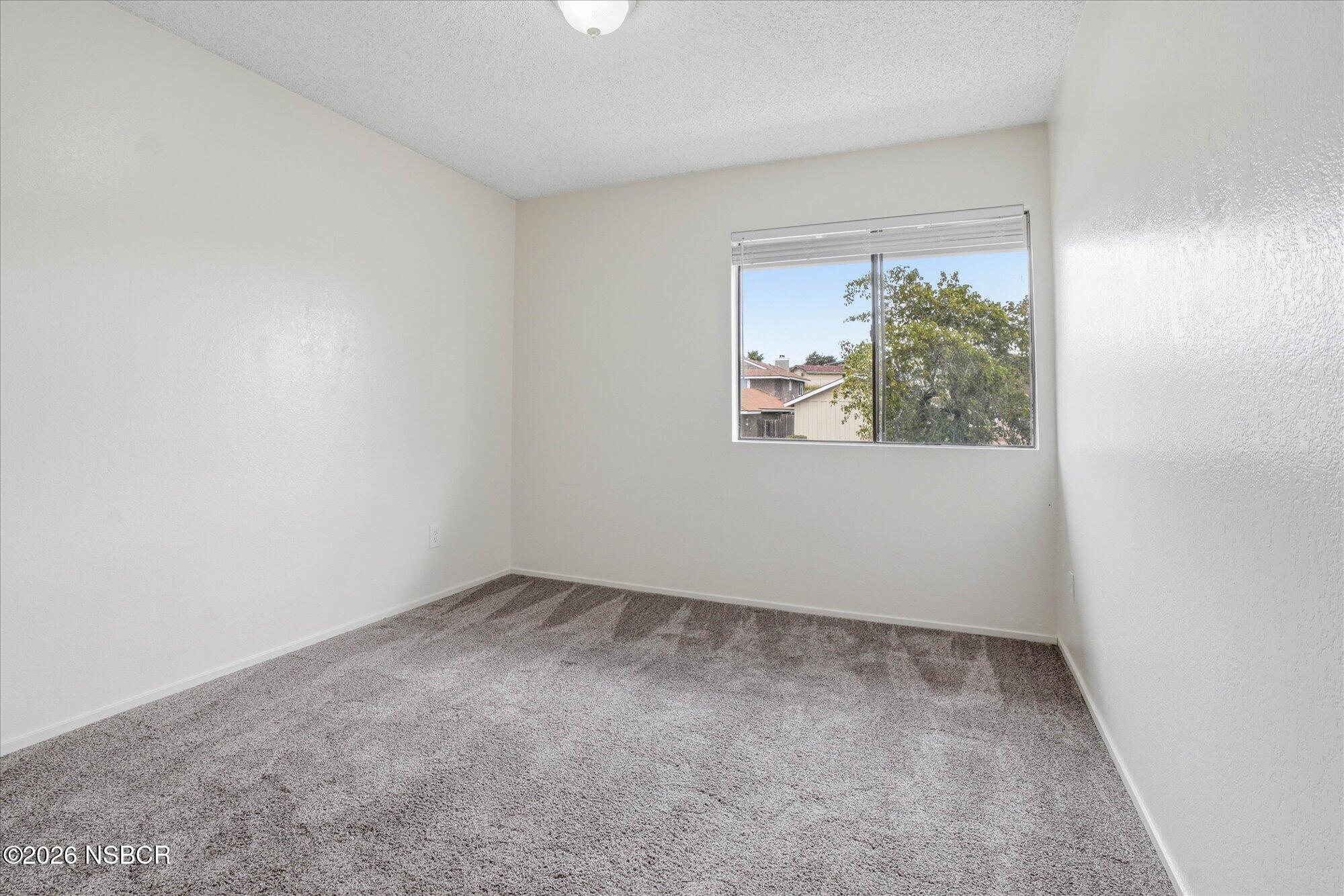 1192 Sumner Place, Unit D Santa Maria, CA 93455 - Photo 13 of 18 an empty room with a window