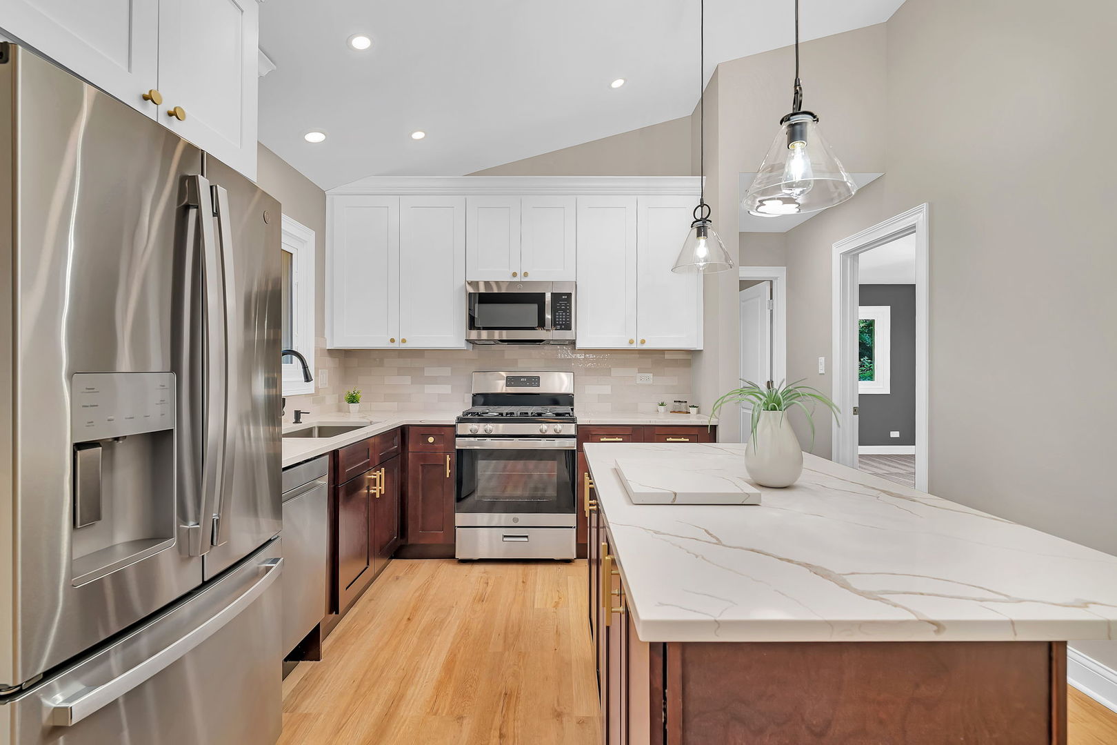 1520 Lighthouse Drive Naperville, IL 60565 - Photo 12 of 36 a kitchen with kitchen island a counter space a sink appliances and cabinets