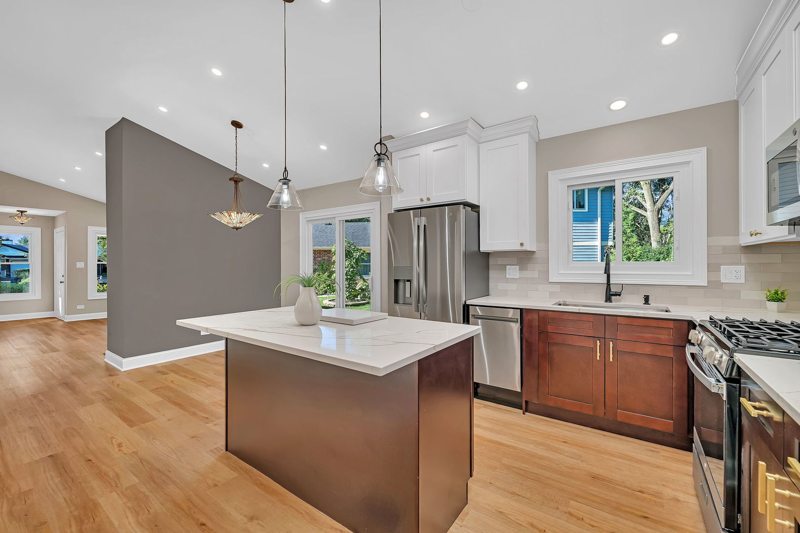 1520 Lighthouse Drive Naperville, IL 60565 - Photo 16 of 36 a kitchen with stainless steel appliances granite countertop wooden floors sink and cabinets