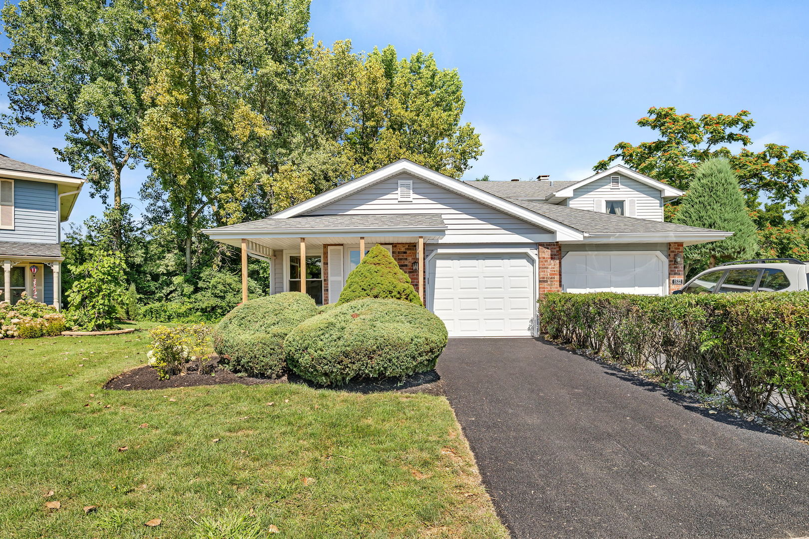 1520 Lighthouse Drive Naperville, IL 60565 - Photo 2 of 36 a front view of a house with a garden