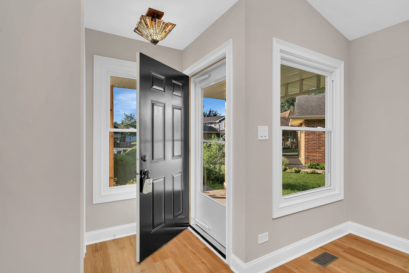 1520 Lighthouse Drive Naperville, IL 60565 - Photo 4 of 36 a view of a hallway view with wooden floor and windows