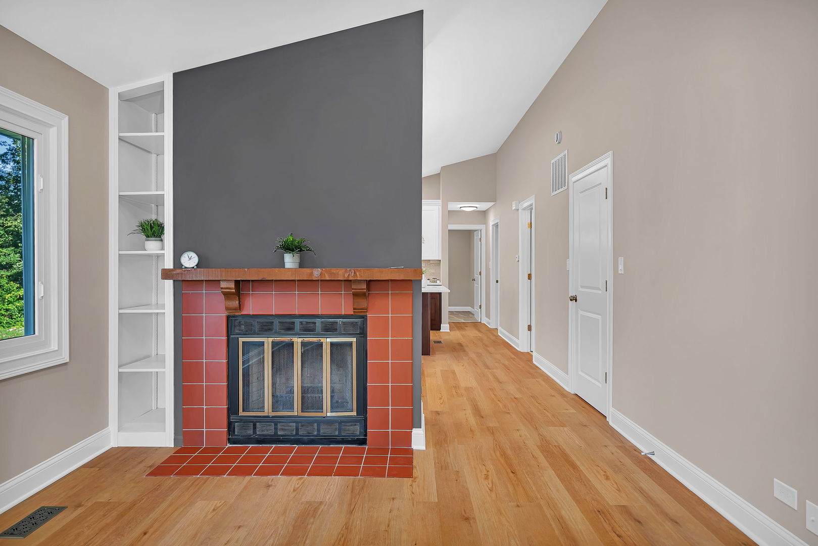 1520 Lighthouse Drive Naperville, IL 60565 - Photo 7 of 36 a view of an empty room with wooden floor and a window