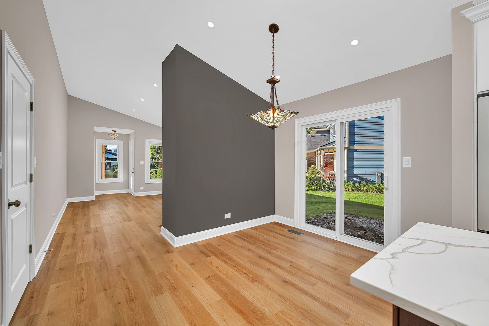 1520 Lighthouse Drive Naperville, IL 60565 - Photo 8 of 36 a view of an empty room with window and wooden floor
