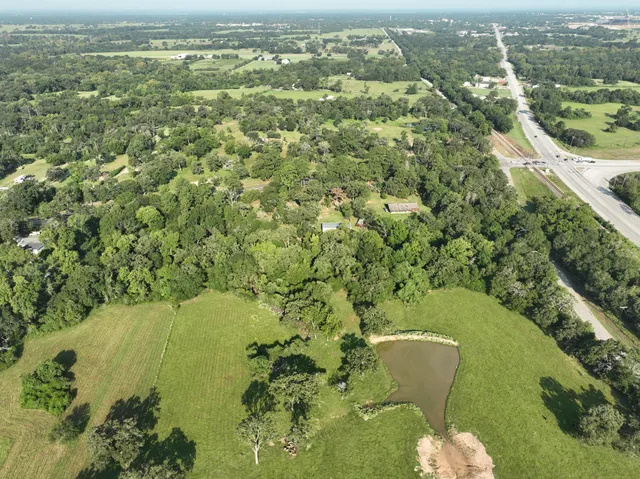 an aerial view of residential houses with outdoor space