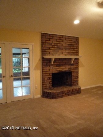 901 Ridgeway Court Orange Park, FL 32065 - Photo 10 of 20 Brick Fireplace and french doors in the
