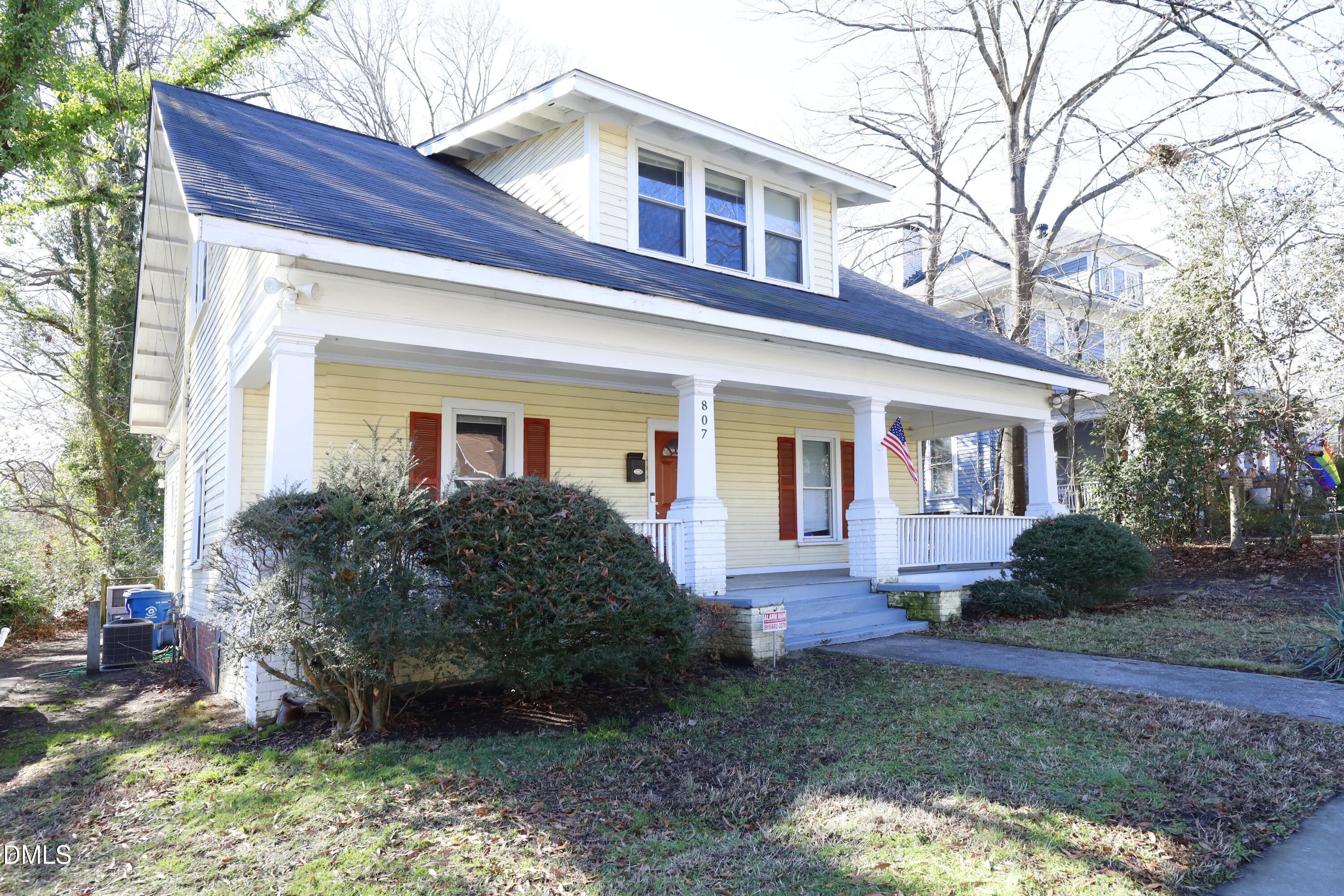 a view of house that has a yard