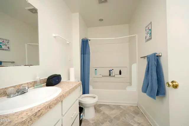 a bathroom with a sink a toilet and a tub