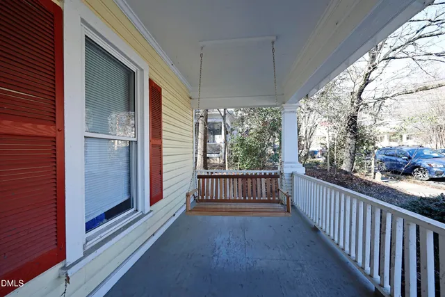 a view of a balcony with wooden floor