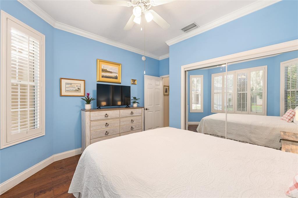 3304 Southwest 38th Street Ocala, FL 34474 - Photo 19 of 21 a bedroom with a large bed and a flat tv screen on dresser