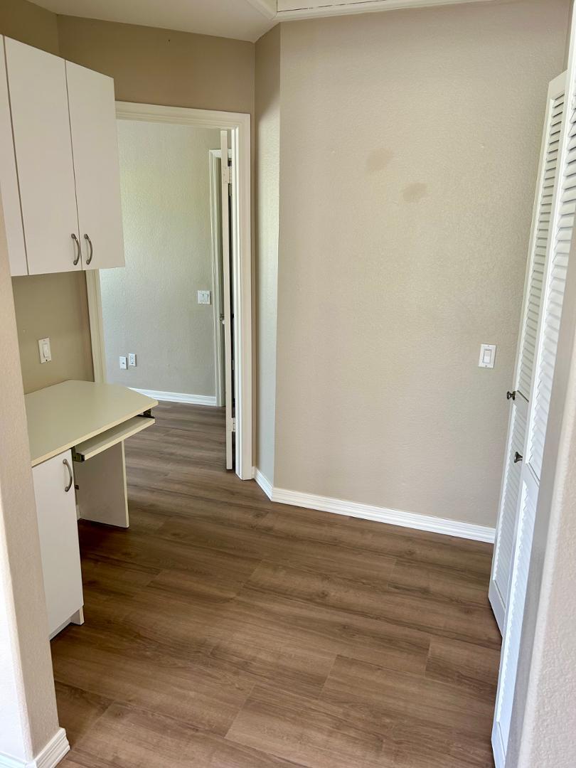 10015 East Mountain View Road, Unit 2009 Scottsdale, AZ 85258 - Photo 11 of 18 an empty room with wooden floor and a window
