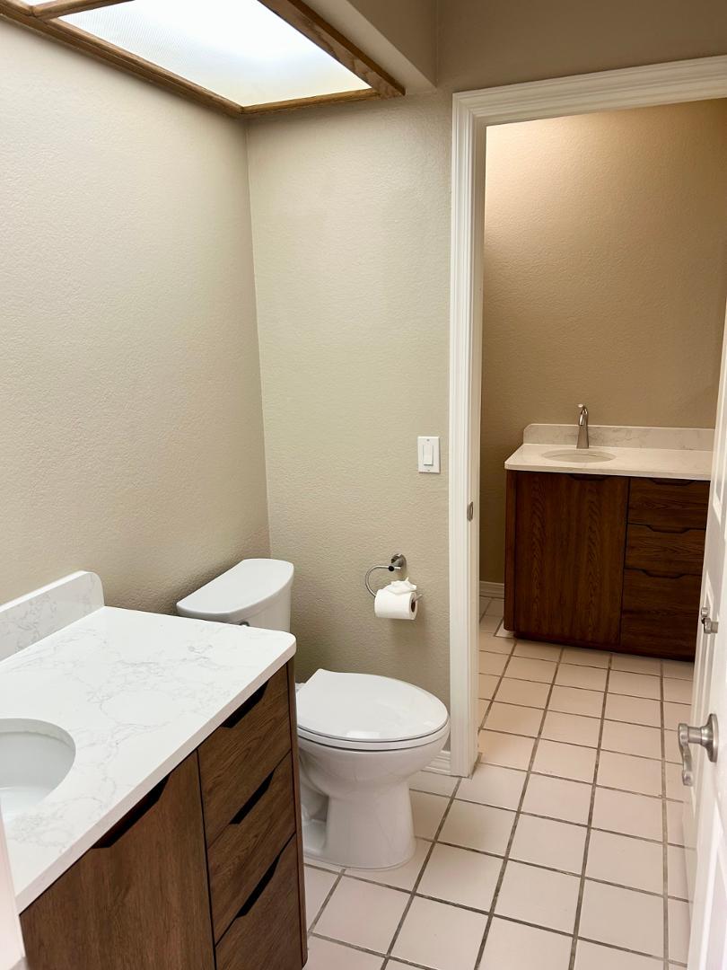10015 East Mountain View Road, Unit 2009 Scottsdale, AZ 85258 - Photo 12 of 18 a bathroom with a sink a toilet and shower