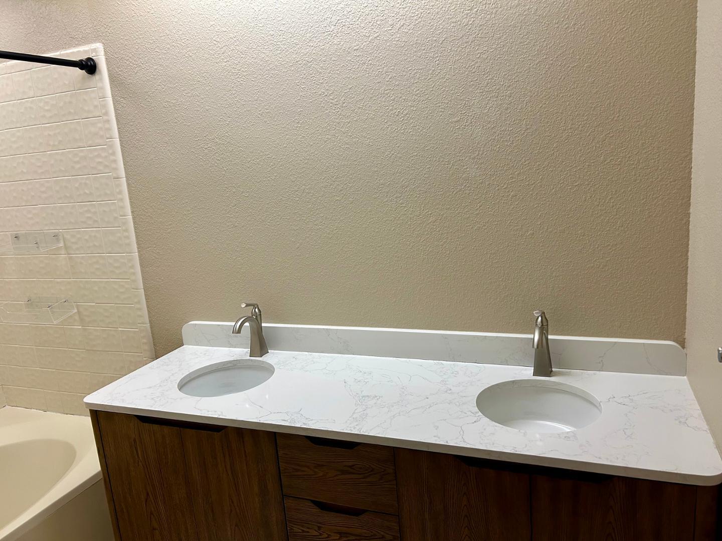 10015 East Mountain View Road, Unit 2009 Scottsdale, AZ 85258 - Photo 14 of 18 a bathroom with a sink and a mirror