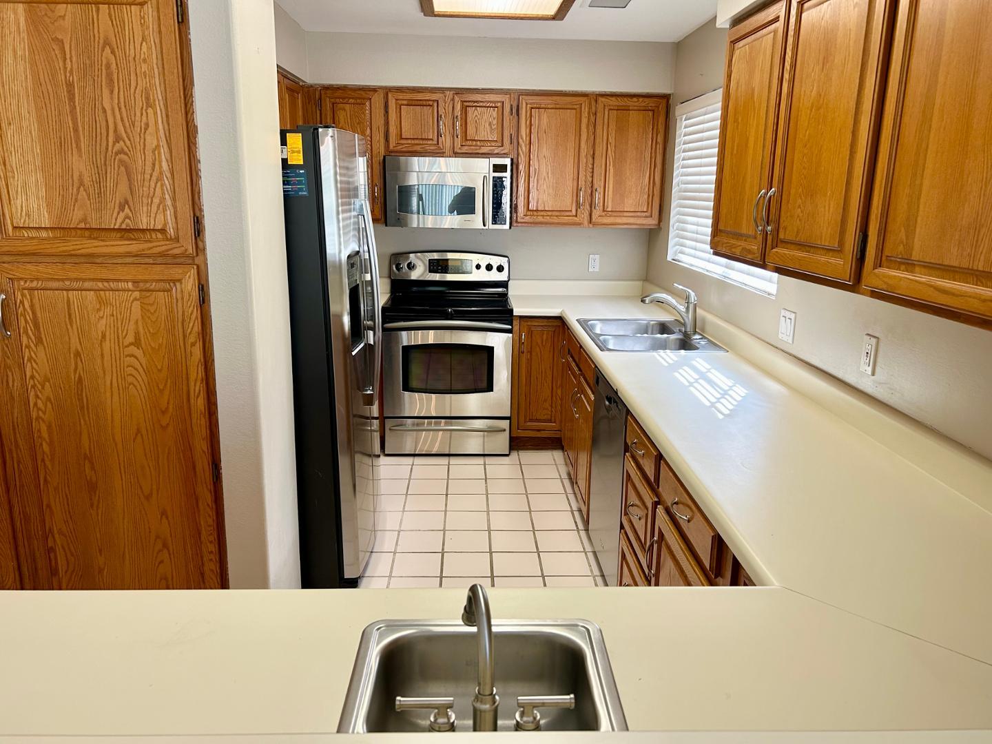 10015 East Mountain View Road, Unit 2009 Scottsdale, AZ 85258 - Photo 5 of 18 a kitchen with a sink a stove and cabinets