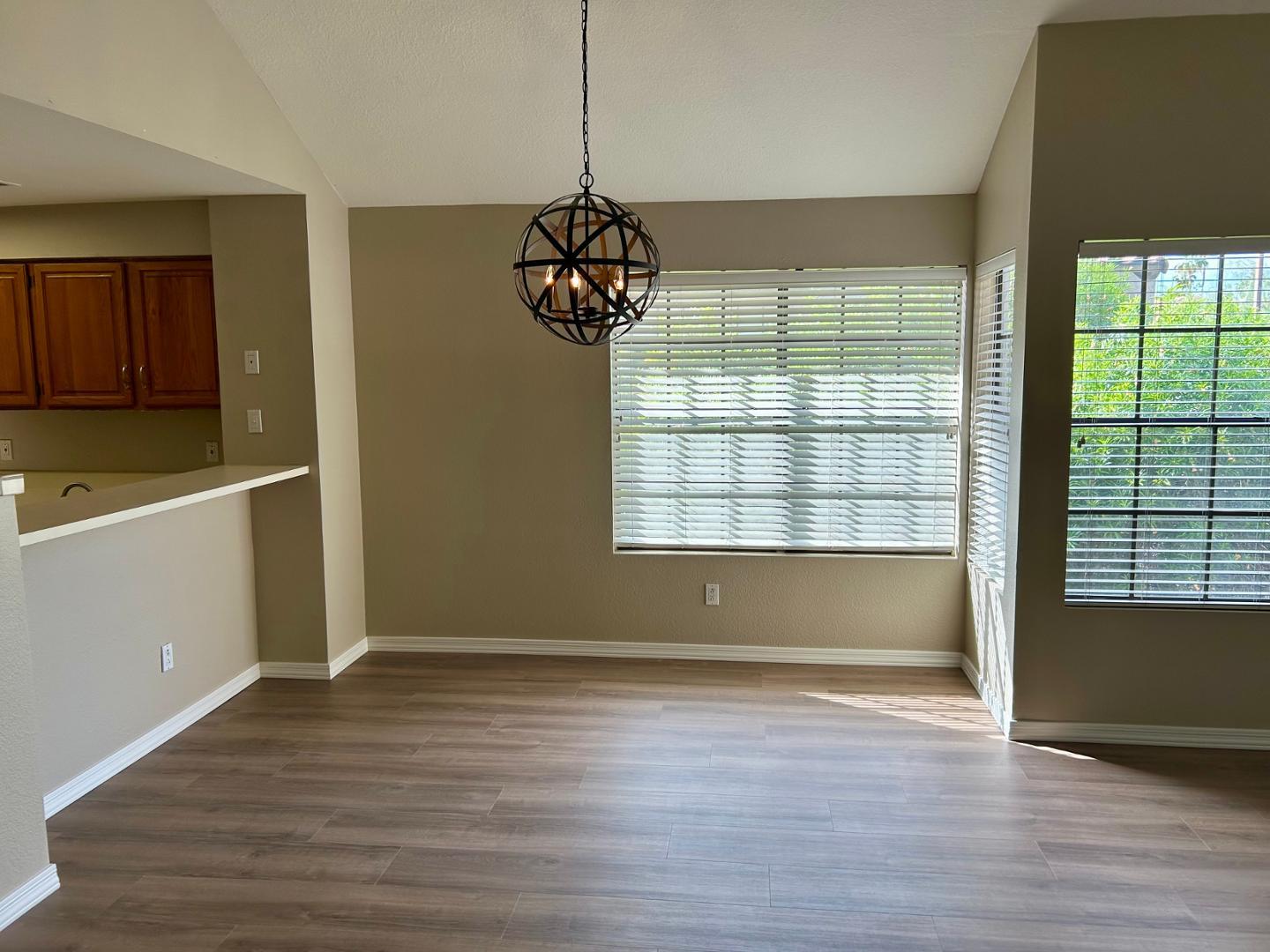 10015 East Mountain View Road, Unit 2009 Scottsdale, AZ 85258 - Photo 7 of 18 a view of wooden floor and windows in a room