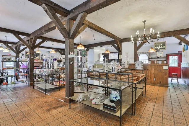 a view of a room with lots of wooden furniture