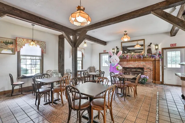 a dining area with furniture and outdoor view